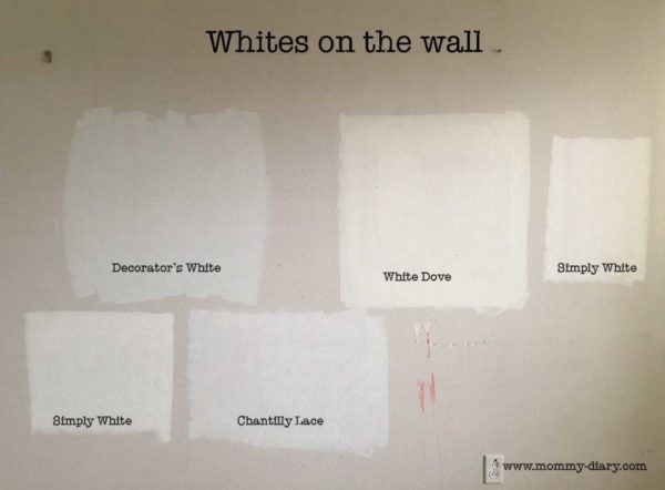 testing white paint colors on wall