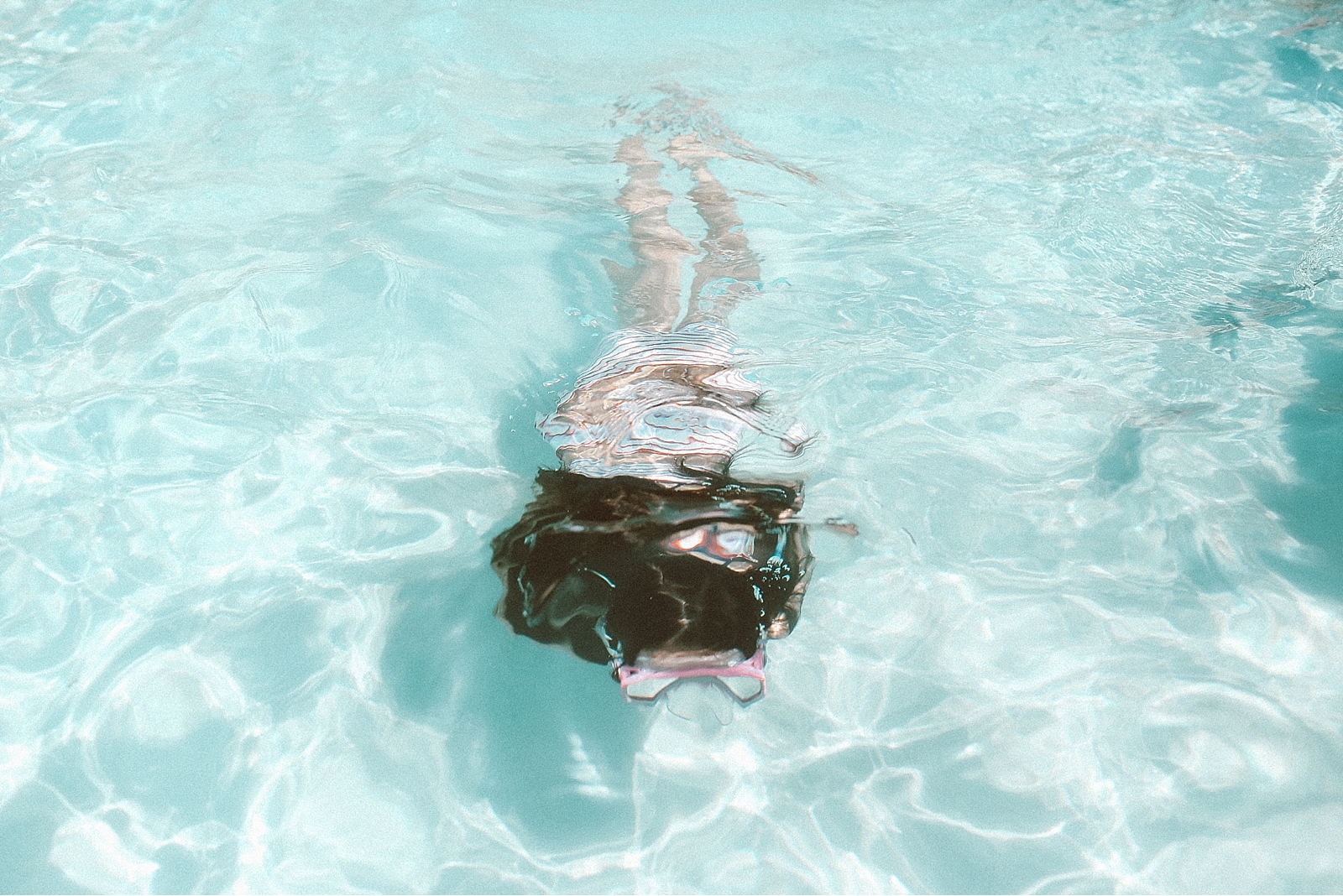 girl swimming in pool