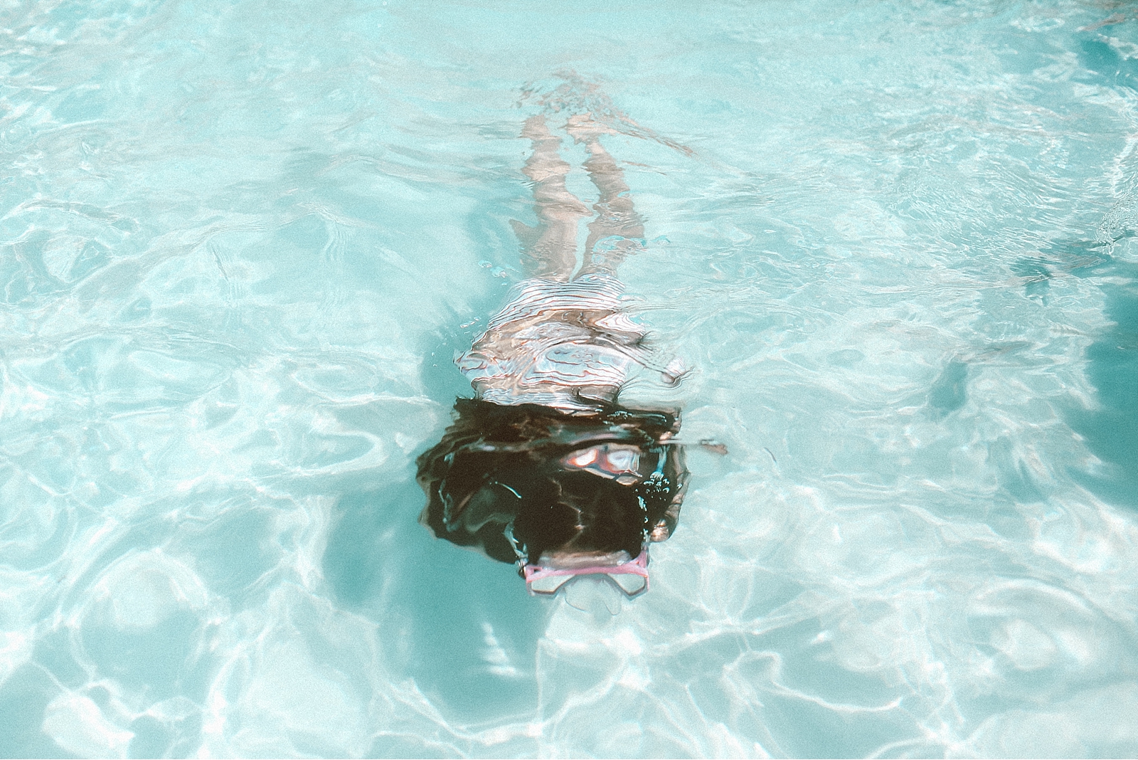 girl swimming in the pool