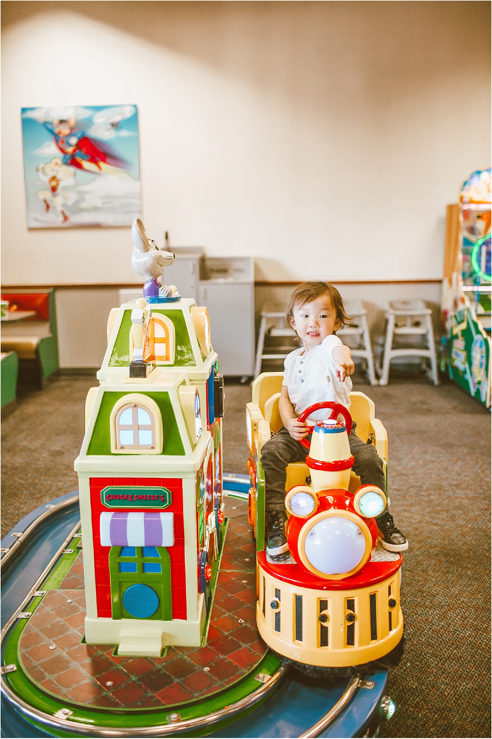 little boy riding mini train