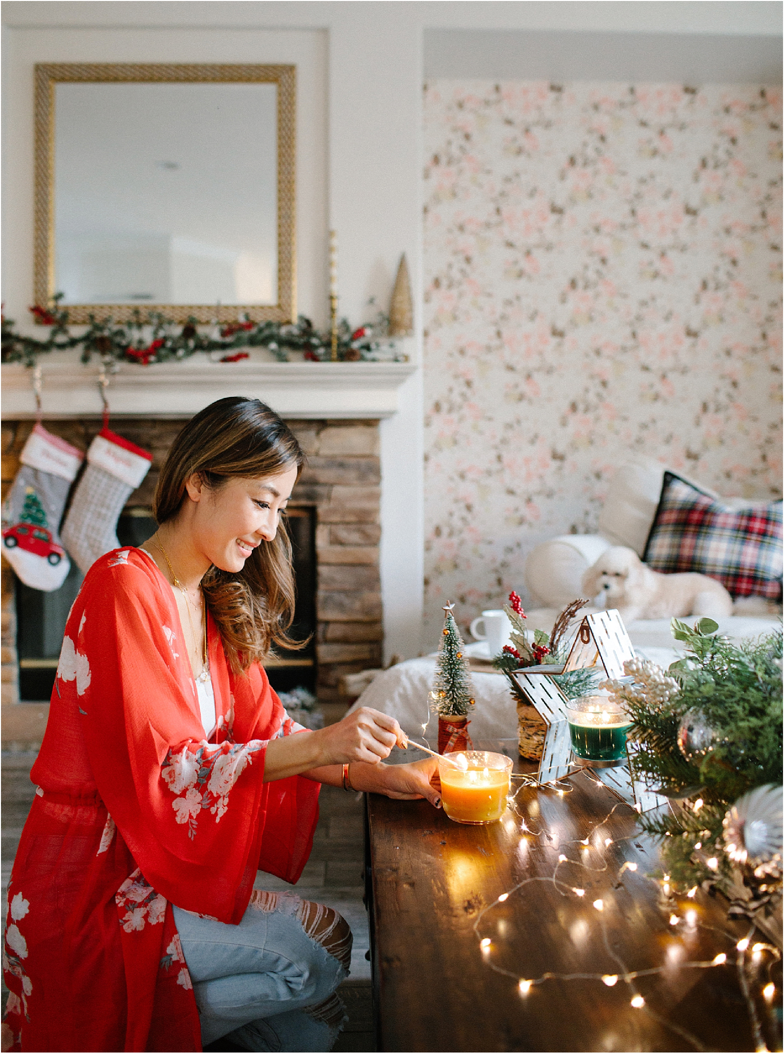 woman lighting holiday candle
