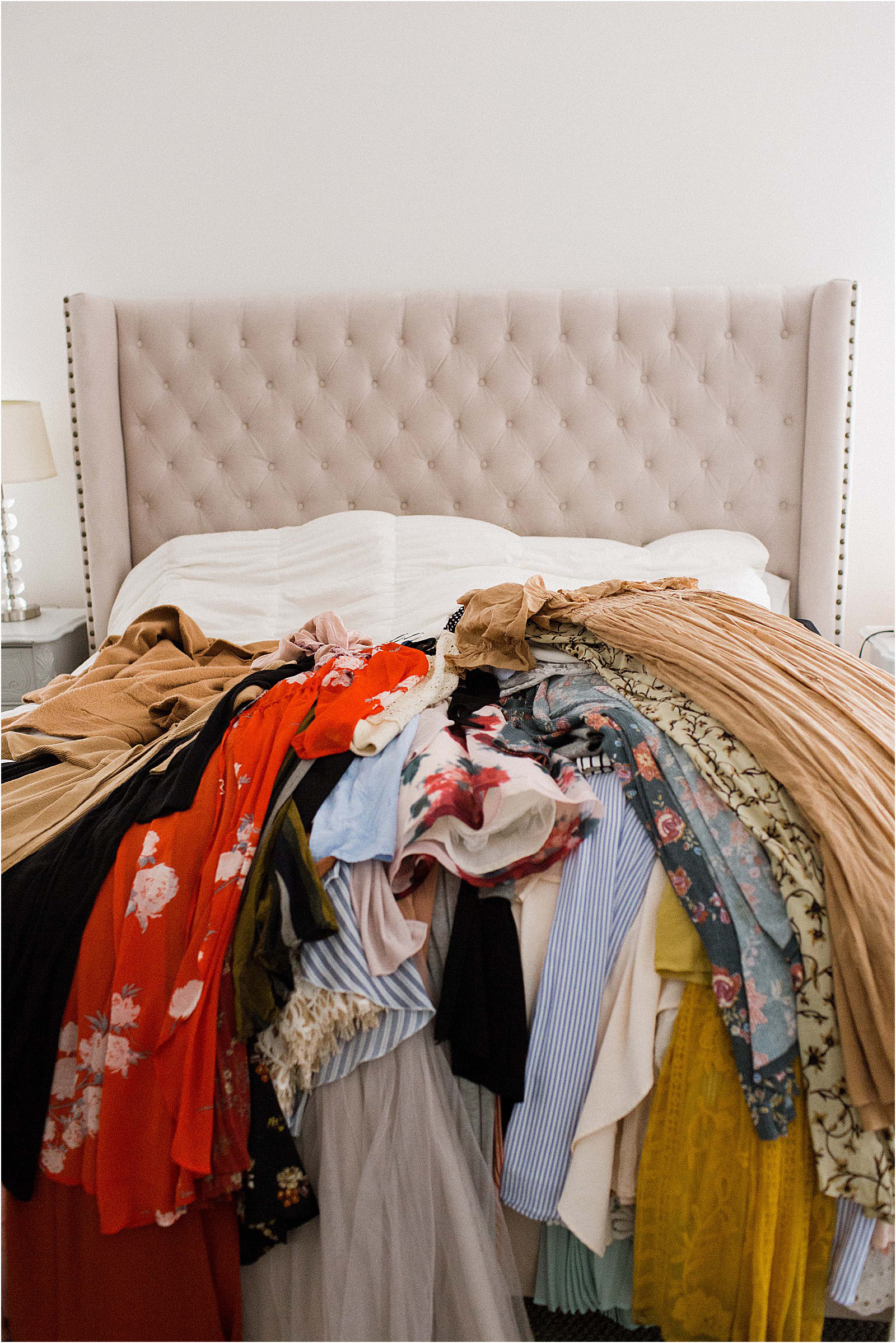 pile of clothes on the bed