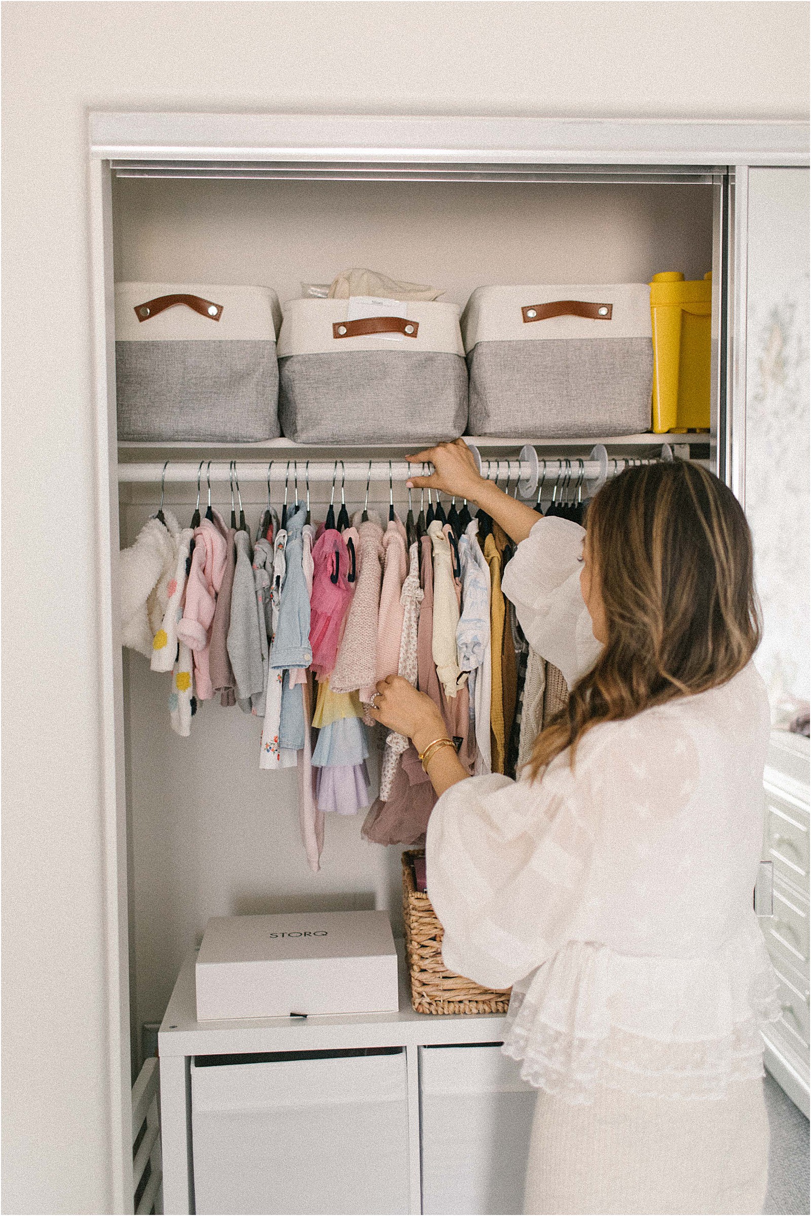 Organizing baby shop clothes in drawers