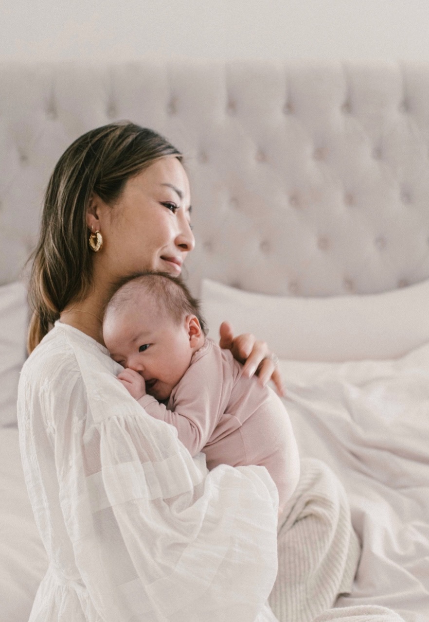 mother holding newborn