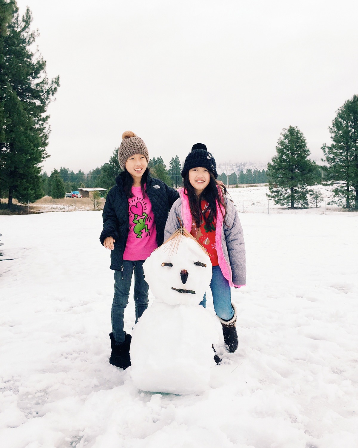 little girls and a snowman